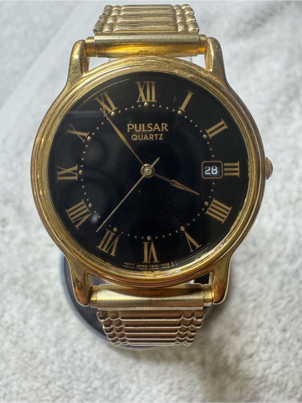 Pulsar Gold-Tone Watch with Black Dial and Roman Numerals